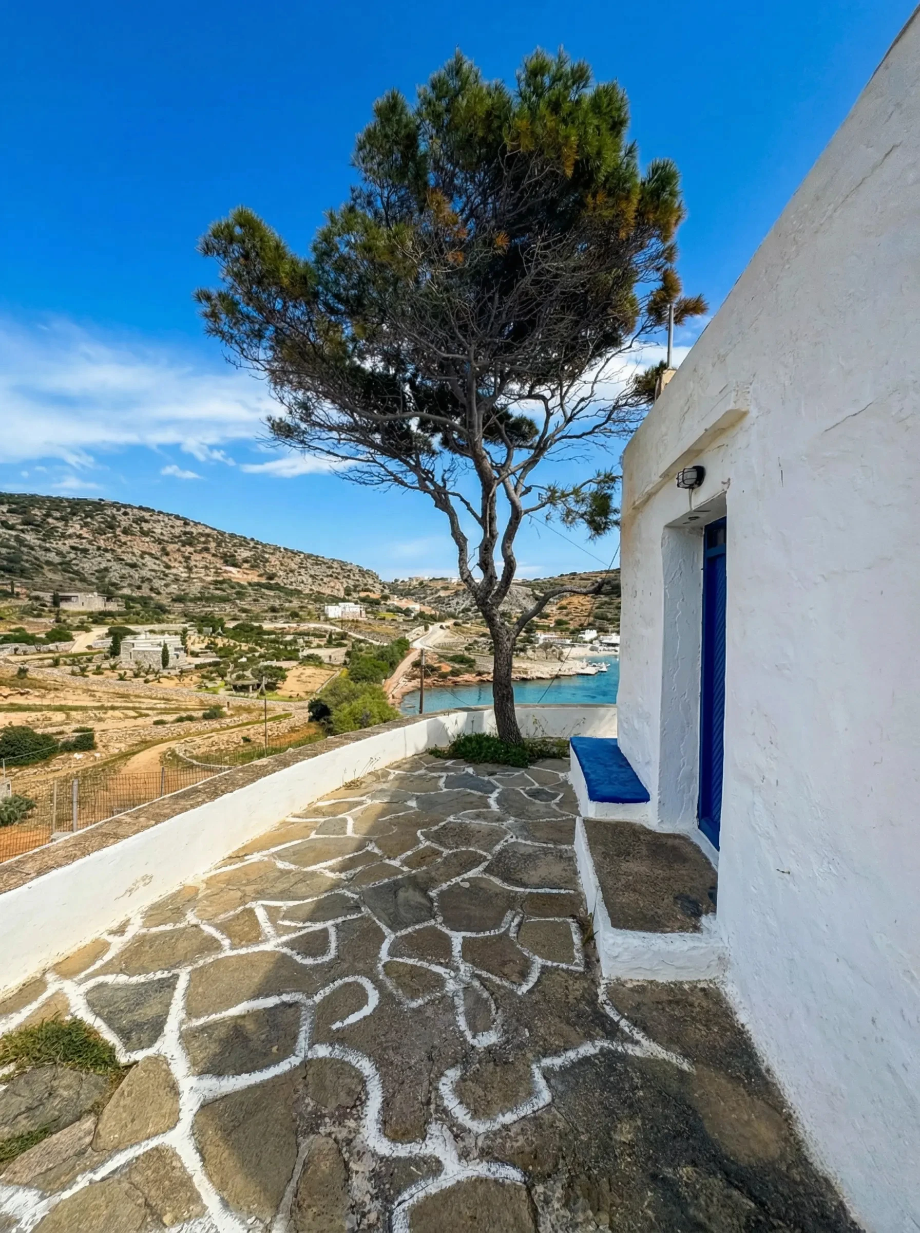 Casa Mersini exterior terrace with sea view above Mersini Beach in Schinoussa