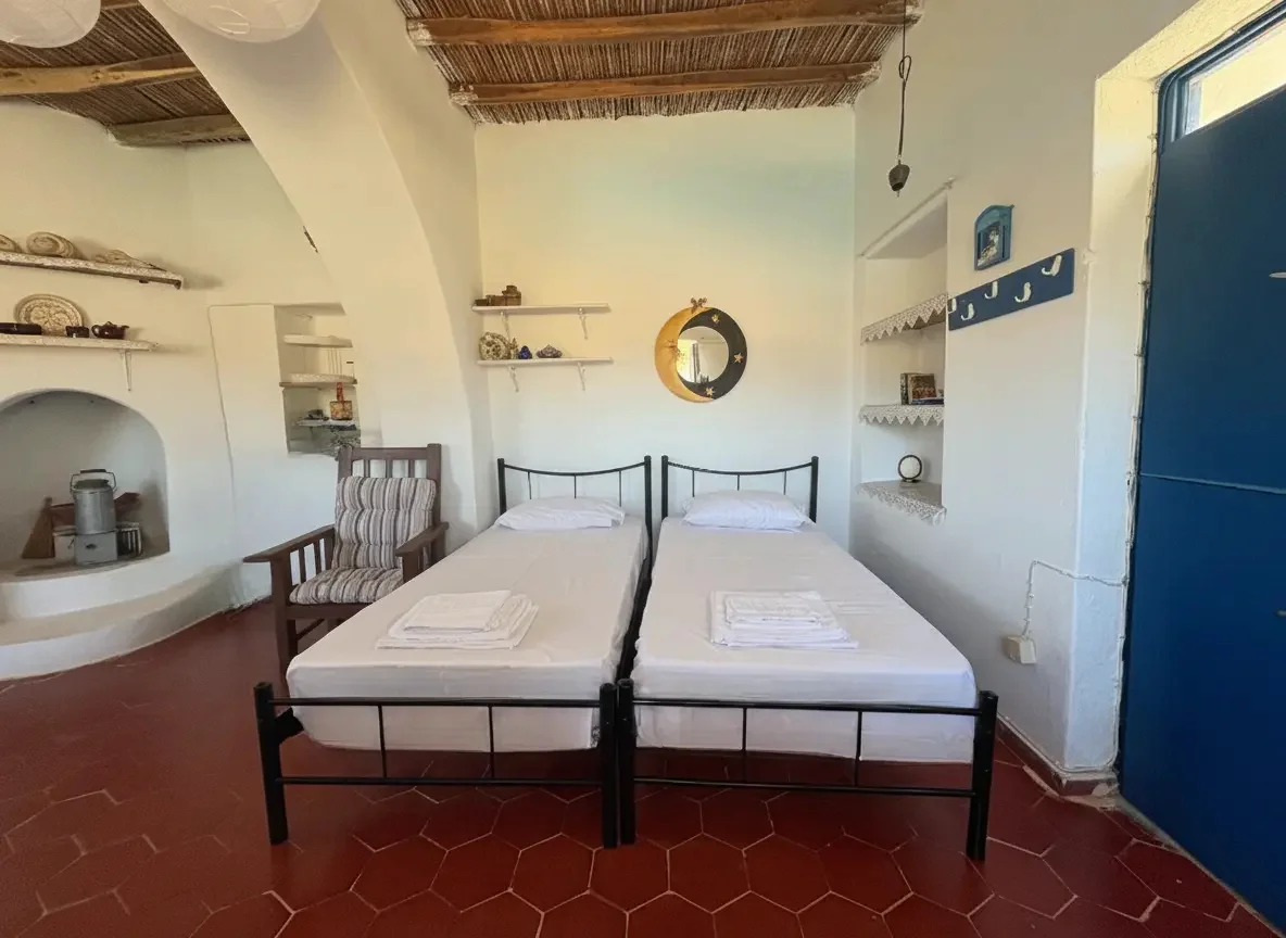 Twin beds inside the Casa Mersini Schinoussa room for rent